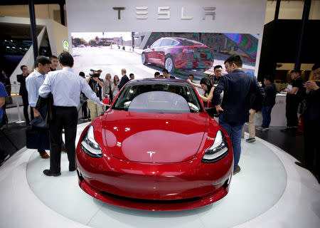 FILE PHOTO: A Tesla Model 3 car is displayed during a media preview at the Auto China 2018 motor show in Beijing, China April 25, 2018. REUTERS/Jason Lee/File Photo