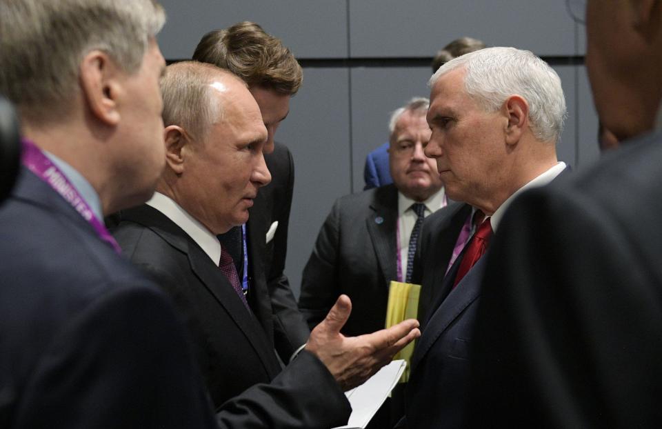 Vice President Mike Pence and Russian President Vladimir Putin in Singapore.