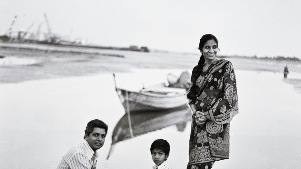 Ramesh Shukla (left) with his wife, Taru, and son, Neel, by the banks of Dubai Creek in the 1970s. - Courtesy of Four Seasons Ramesh Gallery