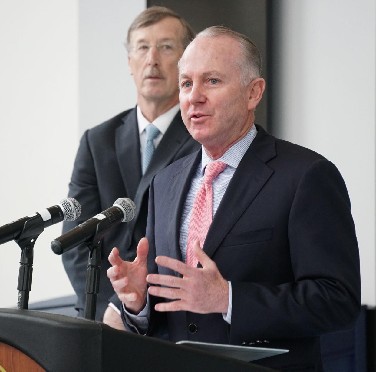 Care New England President and CEO Dr. James E. Fanale, left, with Lifespan President and CEO Dr. Timothy J. Babineau.