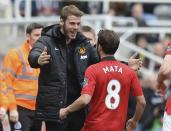 Manchester United's Juan Mata (R) celebrates with teammate goalkeeper David De Gea after scoring a goal against Newcastle United during their English Premier League soccer match at St James' Park in Newcastle, northern England April 5, 2014. REUTERS/Nigel Roddis (BRITAIN - Tags: SPORT SOCCER) FOR EDITORIAL USE ONLY. NOT FOR SALE FOR MARKETING OR ADVERTISING CAMPAIGNS. NO USE WITH UNAUTHORIZED AUDIO, VIDEO, DATA, FIXTURE LISTS, CLUB/LEAGUE LOGOS OR "LIVE" SERVICES. ONLINE IN-MATCH USE LIMITED TO 45 IMAGES, NO VIDEO EMULATION. NO USE IN BETTING, GAMES OR SINGLE CLUB/LEAGUE/PLAYER PUBLICATIONS