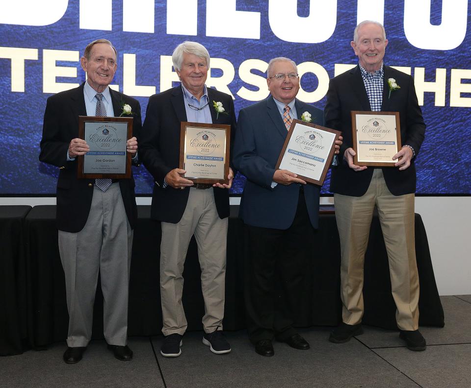 NFL public relations personnel pose for a group photo after receiving the Pro Football Hall of Fame Award of Excellence Thursday, June 30, 2022 at the Pro Football Hall of Fame. 