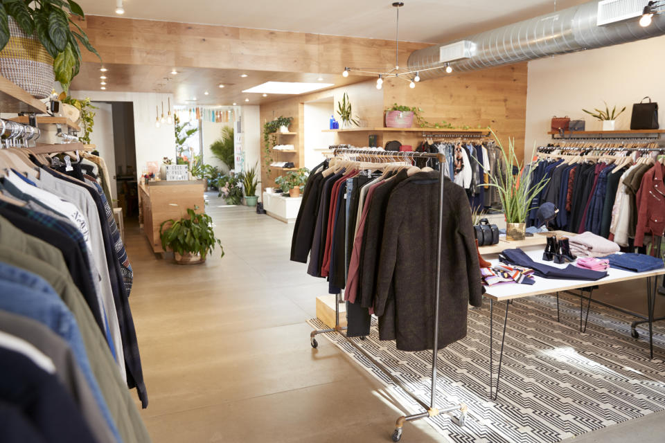 Men's jackets on racks in an upscale clothing store