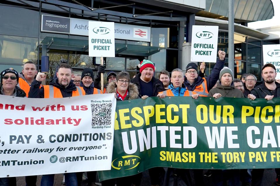 Railway staff outside Ashford International station in Kent during Friday’s RMT strike (PA)