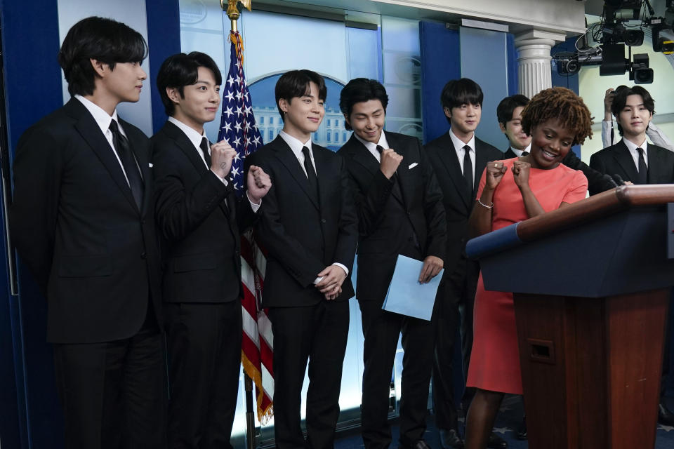 Members of the K-pop supergroup BTS, from left, V, Jungkook, Jimin, RM, Jin, J-Hope, Suga, join White House press secretary Karine Jean-Pierre during the daily briefing at the White House in Washington, Tuesday, May 31, 2022. (AP Photo/Susan Walsh)