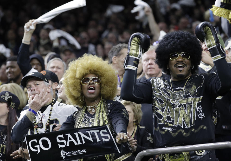 Fans cheer during the first half of an NFC championship game between the Saints and Rams. (AP)