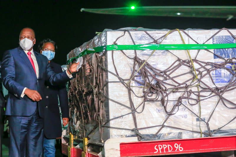 Kenya's Cabinet Secretary for Health Mutahi Kagwe receives the first batch of AstraZeneca/Oxford vaccines against the coronavirus disease (COVID-19) at the Jomo Kenyatta international airport in Nairobi