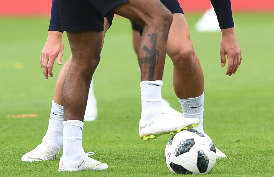 Raheem Sterling’s gun tattoo is visible on his leg during an England training session at St Georges Park on May 28, 2018 in Burton-upon-Trent, England. (Getty Images)