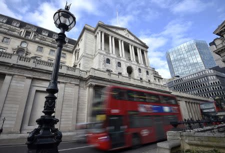 A bus passes the Bank of England in the City of London, Britain, February 14, 2017. REUTERS/Hannah McKay