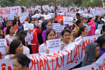 Vietnamese Catholics gather to protest against the Special Economic Zone's and cyber security's laws after a Sunday mass at a church in Ha Tinh province, Vietnam June 17, 2018. Photo taken June 17, 2018. REUTERS/Stringer