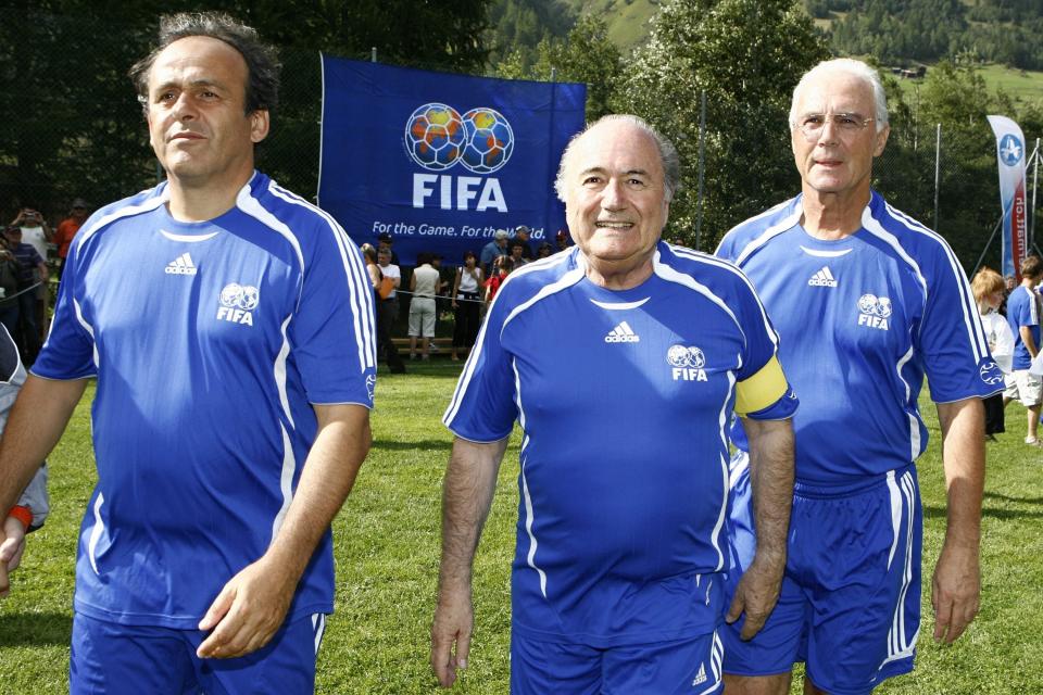 FILE - In this Aug. 26, 2007 file photo FIFA President Sepp Blatter, center, UEFA President Michel Platini, left, and German soccer legend Franz Beckenbauer, right, arrive for a gala match between FIFA and Team 2000 in the 10th edition of the 'Sepp Blatter Tournament', in Ulrichen, Switzerland. Germany's World Cup-winning coach Franz Beckenbauer has died. He was 78. Beckenbauer was one of German soccer's central figures. He captained West Germany to the World Cup title in 1974. He also coached the national side for its 1990 World Cup win against Argentina. (Laurent Gillieron/Keystone via AP, file)