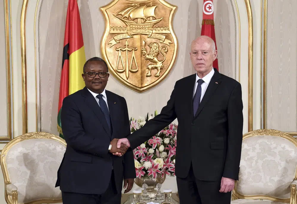 Tunisian President Kais Saied, right, shakes hands with President of Guinea-Bissau Umaro Sissoco Embalo before a meeting in Carthage, near Tunis, Tunisia, Wednesday, March 8, 2023. (Slim Abid/Tunisian Presidency via AP)