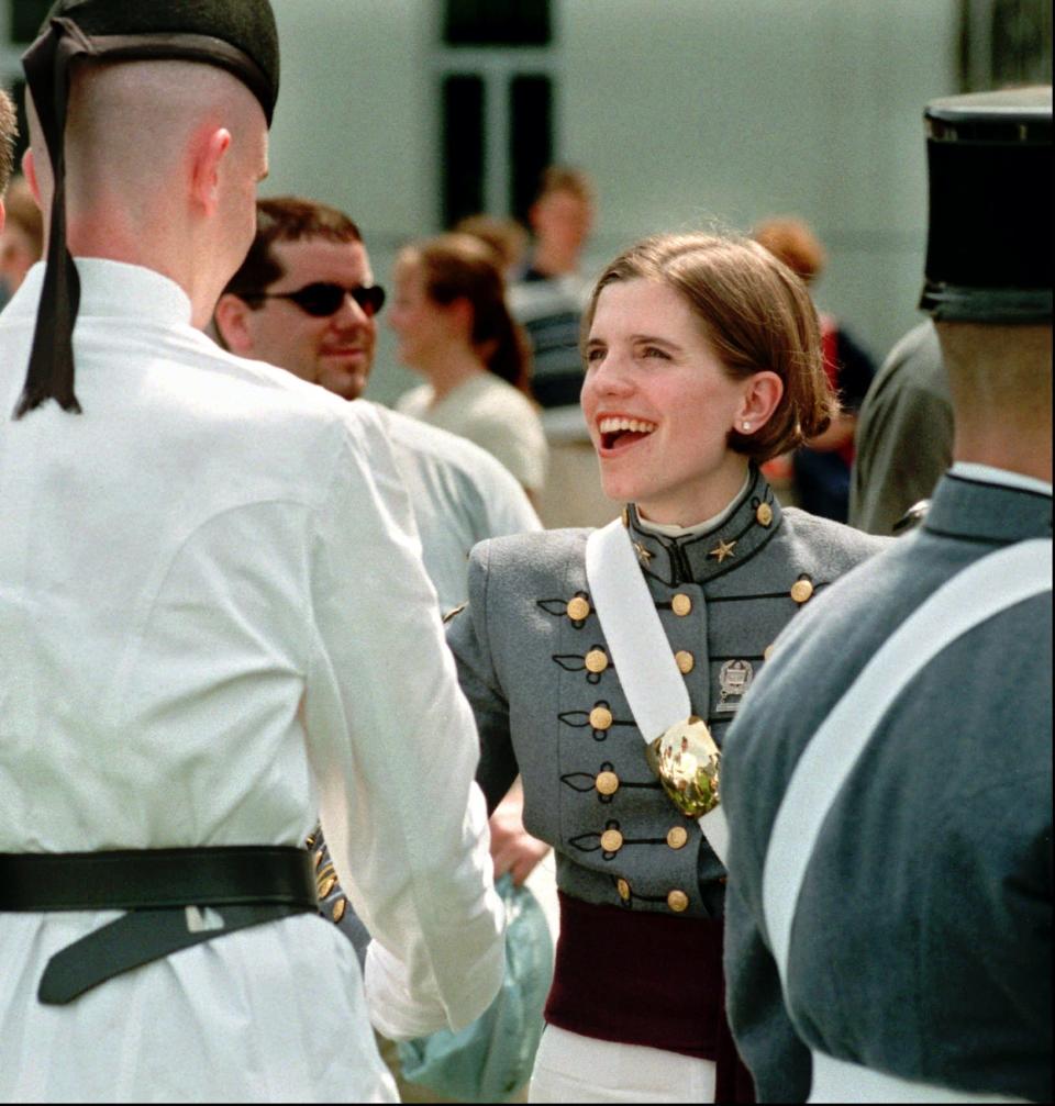 Nancy Mace is congratulated by fellow band members after The Citadel Class of 1999 was dismissed from the long gray line Friday, May 7, 1999, in Charleston, S.C.  Mace was the first woman to be a part of the traditional long gray line, consisting of all the graduating seniors, and became the first woman to graduate from The Citadel.