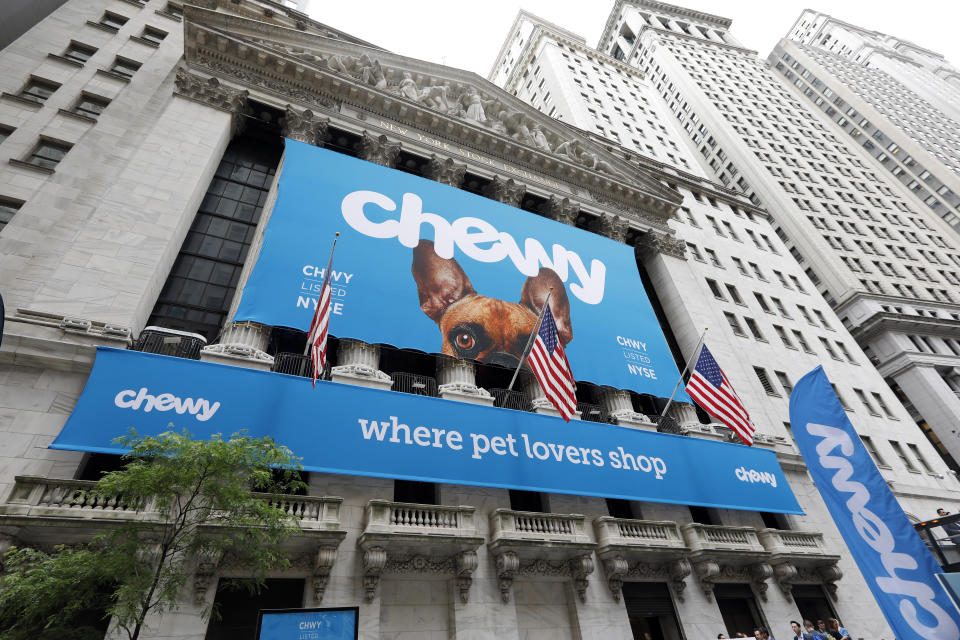 The facade of the New York Stock Exchange is decorated for the Chewy IPO, Friday, June 14, 2019. Chewy, the online seller of pet food and squeaky toys, went public Friday and its shares soared 71%. (AP Photo/Richard Drew)
