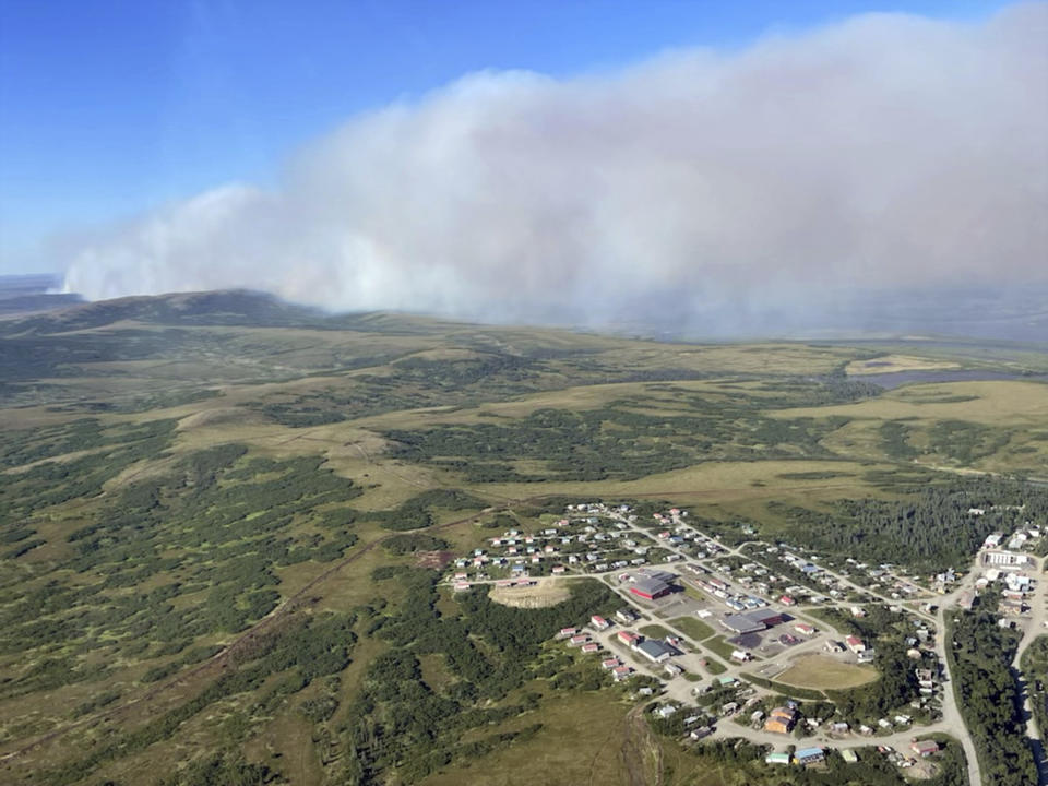 This Friday, June 10, 2022, aerial photo provided by the Bureau of Land Management Alaska Fire Service shows a tundra fire burning near the community of St. Mary's, Alaska. The largest documented wildfire burning through tundra in southwest Alaska was within miles St. Mary's and another nearby Alaska Native village, Pitkas Point, prompting officials Friday to urge residents to prepare for possible evacuation. (Ryan McPherson/Bureau of Land Management Alaska Fire Service via AP)