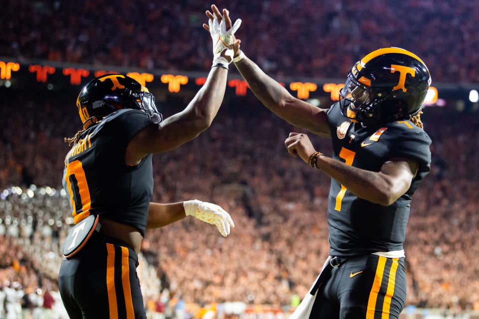 Tennessee quarterback Joe Milton III (7) and Tennessee running back Jaylen Wright (0) celebrate after Wright scored a touchdown during a football game between Tennessee and South Carolina at Neyland Stadium in Knoxville, Tenn., on Saturday, Sept. 30, 2023.