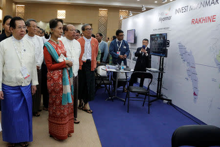 Myanmar's State Counsellor Aung San Suu Kyi visits the Rakhine state booth at Invest Myanmar in Naypidaw, Myanmar, January 28, 2019. REUTERS/Ann Wang
