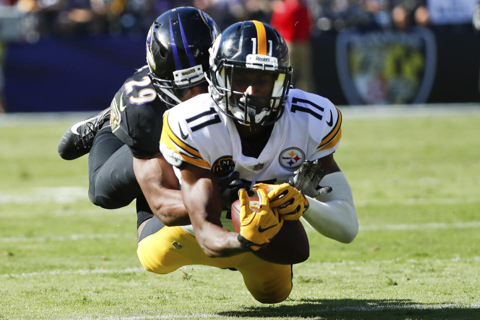 <p>Pittsburgh Steelers wide receiver Justin Hunter (11) is stopped by Baltimore Ravens defensive back Marlon Humphrey (29) during the second half of an NFL football game in Baltimore, Sunday, Oct. 1, 2017. (AP Photo/Alex Brandon) </p>