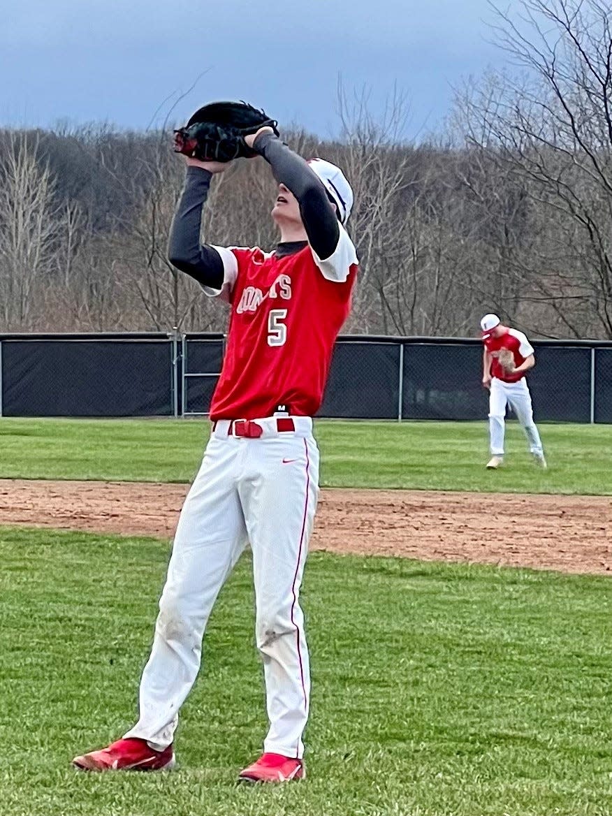 Elgin's Brody Wood catches the final out during their home baseball game with Cardington last week.