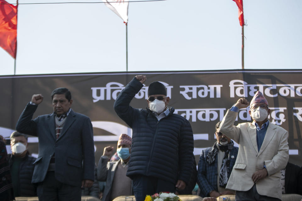 From Left, Narayan Kaji Shrestha, Pushpa Kamal Dahal and Madhav Kumar Nepal, leaders of the splinter group in the governing Nepal Communist Party, participate in a protest in Kathmandu, Nepal, Tuesday, Dec. 29, 2020. Tens of thousands of supporters of the splinter group rallied in the capital on Tuesday demanding the ouster of the prime minister and the reinstatement of the Parliament he dissolved amid an escalating feud in the party. (AP Photo/Niranjan Shrestha)