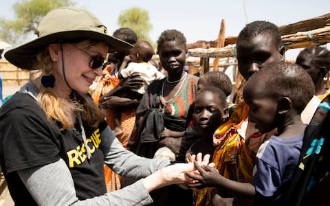 Mia Farrow with children in South Sudan - Credit: Timothy Nesmith/International Rescue Committee