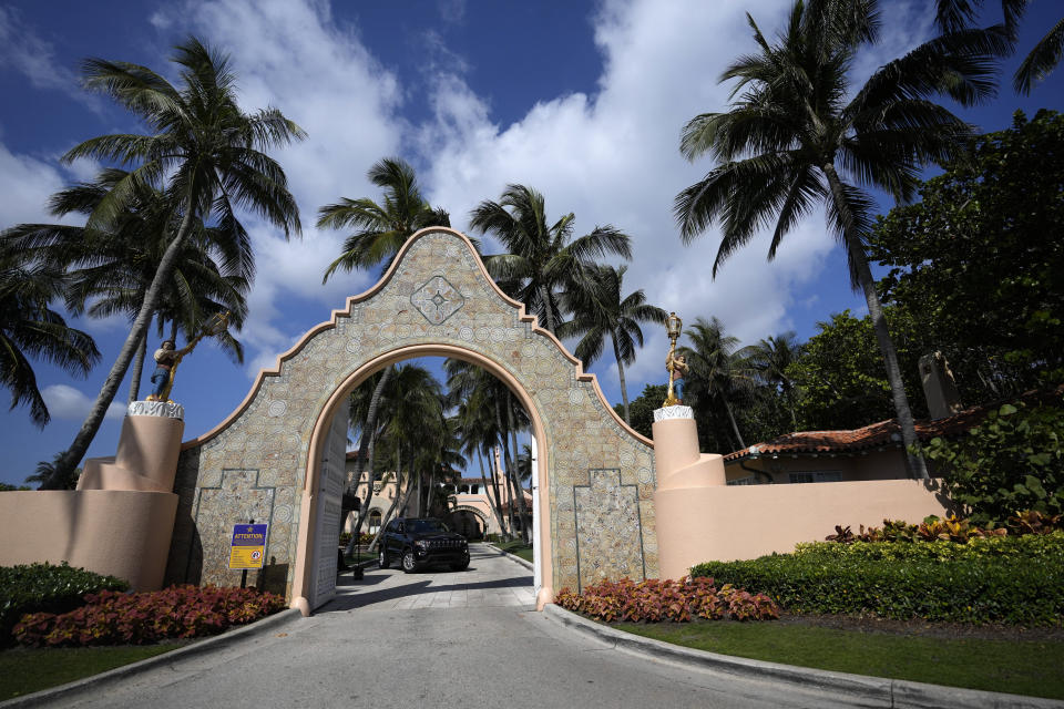 FILE - A security car blocks the drive at the entrance to former President Donald Trump's Mar-a-Lago estate in Palm Beach, Fla., March 29, 2023. Trump faces his most urgent legal challenge in New York, where he’s set to be arraigned this week on charges arising from hush money payments during his 2016 campaign. But other investigations outside Manhattan are pressing forward, underscoring the broad range of peril he confronts as he seeks to reclaim the presidency. (AP Photo/Rebecca Blackwell, File)