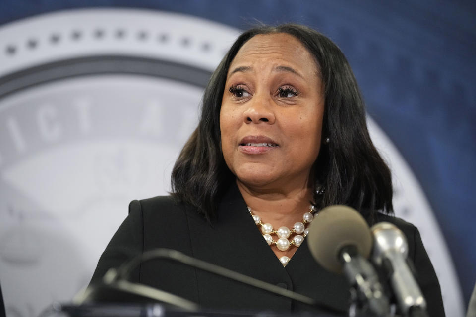 FILE - Fulton County District Attorney Fani Willis speaks in the Fulton County Government Center during a news conference, Aug. 14, 2023, in Atlanta. An Alabama man has been indicted on federal charges that he threatened violence against the Georgia prosecutor and Fulton County, Ga., Sheriff Patrick Labat related to an investigation into former President Donald Trump. The indictment was returned Wednesday, Oct. 25, 2023, and unsealed Monday, Oct. 30. (AP Photo/John Bazemore, File)