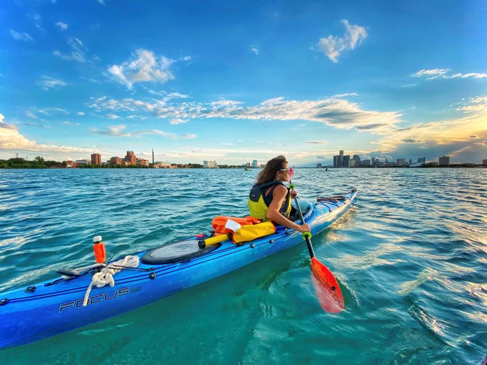 Missy Kinyon, of Grosse Pointe Park, owner of Outpost Detroit, kayaking on the Detroit River in 2022.