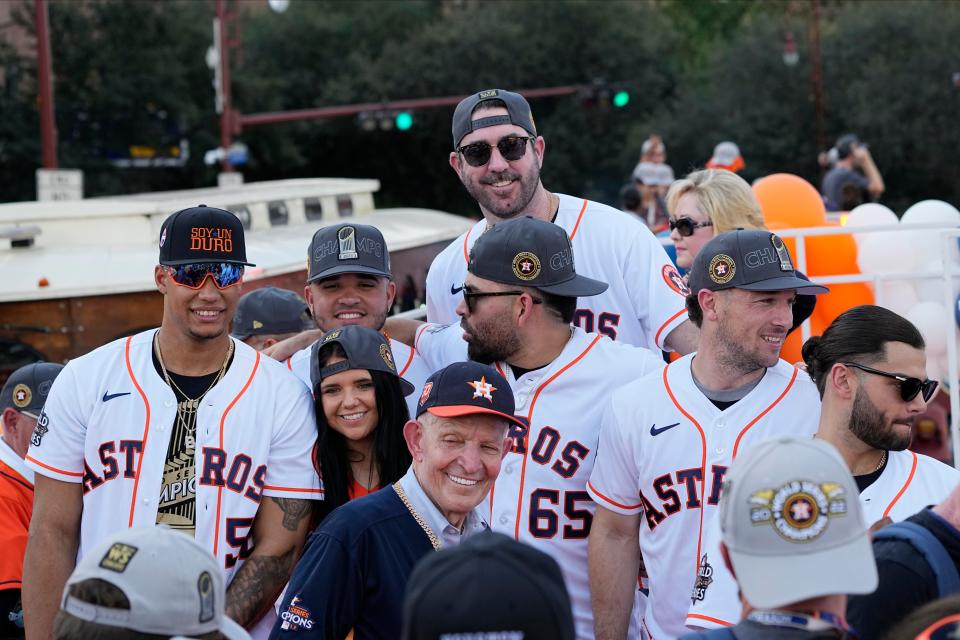 Jim "Mattress Mack" McIngvale, foreground, a prolific Texas gambler, and the Houston Astros players gather before a victory parade for the Houston Astros' World Series baseball championship Monday, Nov. 7, 2022, in Houston. (AP Photo/David Phillip)