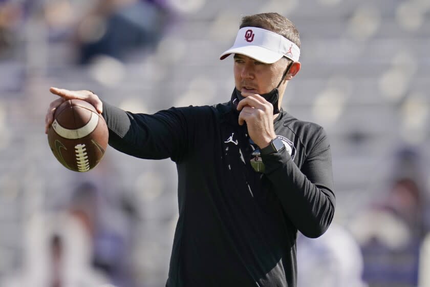 Oklahoma coach Lincoln Riley shouts to his team before a 2020 game against Kansas State