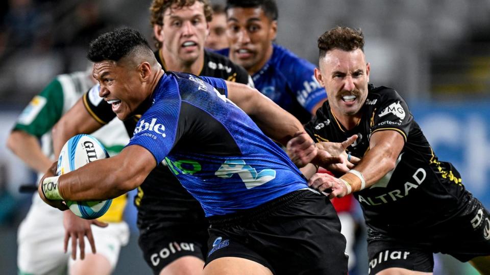 Western Force captain Nic White tries, and fails, to make a tackle. 