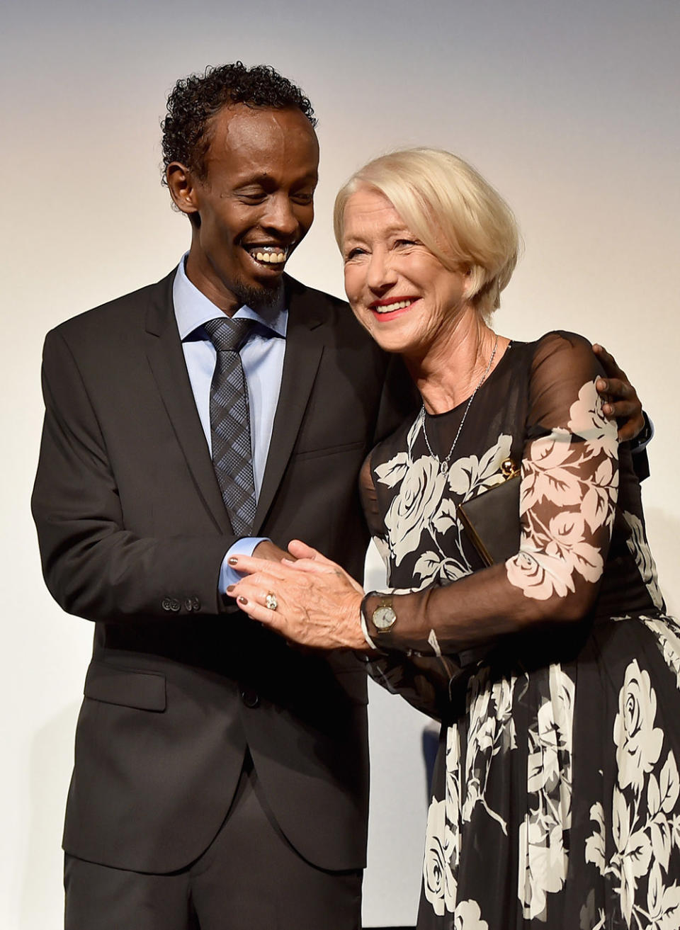 Actors Barkhad Abdi (L) and Helen Mirren attend the "Eye in the Sky" premiere during the 2015 Toronto International Film Festival at Roy Thomson Hall on September 11, 2015 in Toronto, Canada.