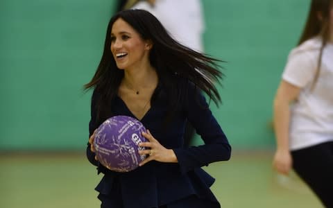 The Duchess of Sussex joins netball training - Credit: Eddie Mulholland For The Telegraph