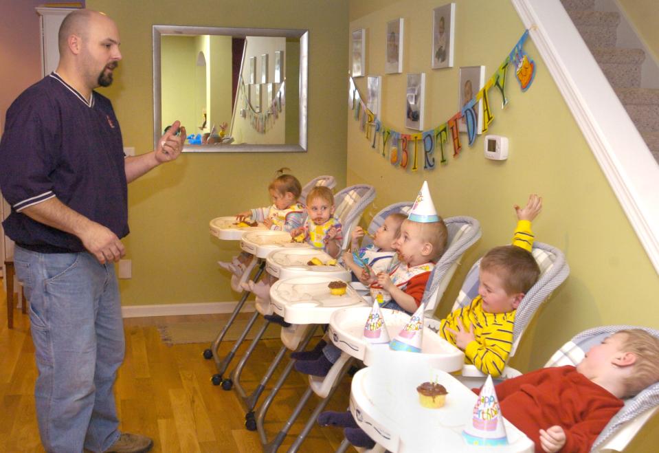 In this photo taken in January 2006, Ben Van Houten keeps a close watch on his sons and daughters as they eat their cupcakes, celebrating their second birthdays in Holland, Mich. The children are, from back to front: Samantha, Kennedy, Peyton, Nolan, John and Gerrit. A relative says Ben Van Houten suffered a fatel heart attack Wednesday night, April 9, 2014, after setting up a trampoline at his home in the Holland-area in western Michigan. The father of Michigan's first surviving set of sextuplets was 39. (AP Photo/The Grand Rapids Press, Cory Olsen) ALL LOCAL TV OUT; LOCAL TV INTERNET OUT