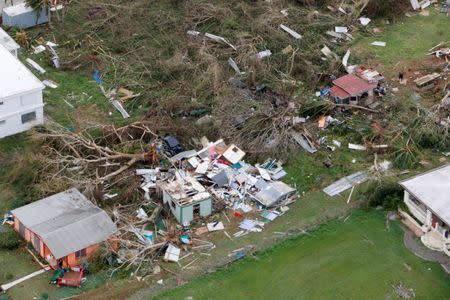 FILE PHOTO: A destroyed home is seen from a Marine Corps MV-22 Osprey surveying the aftermath from Hurricane Maria in St. Croix, U.S. Virgin Islands September 21, 2017. REUTERS/Jonathan Drake