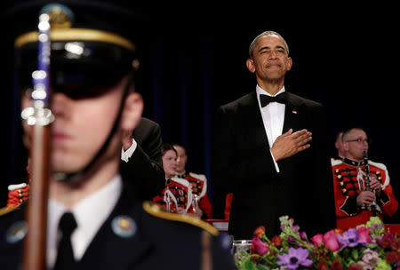 U.S. President Barack Obama stands during a presentation of colors at the White House Correspondents Association's annual dinner in Washington, U.S., April 30, 2016. REUTERS/Yuri Gripas