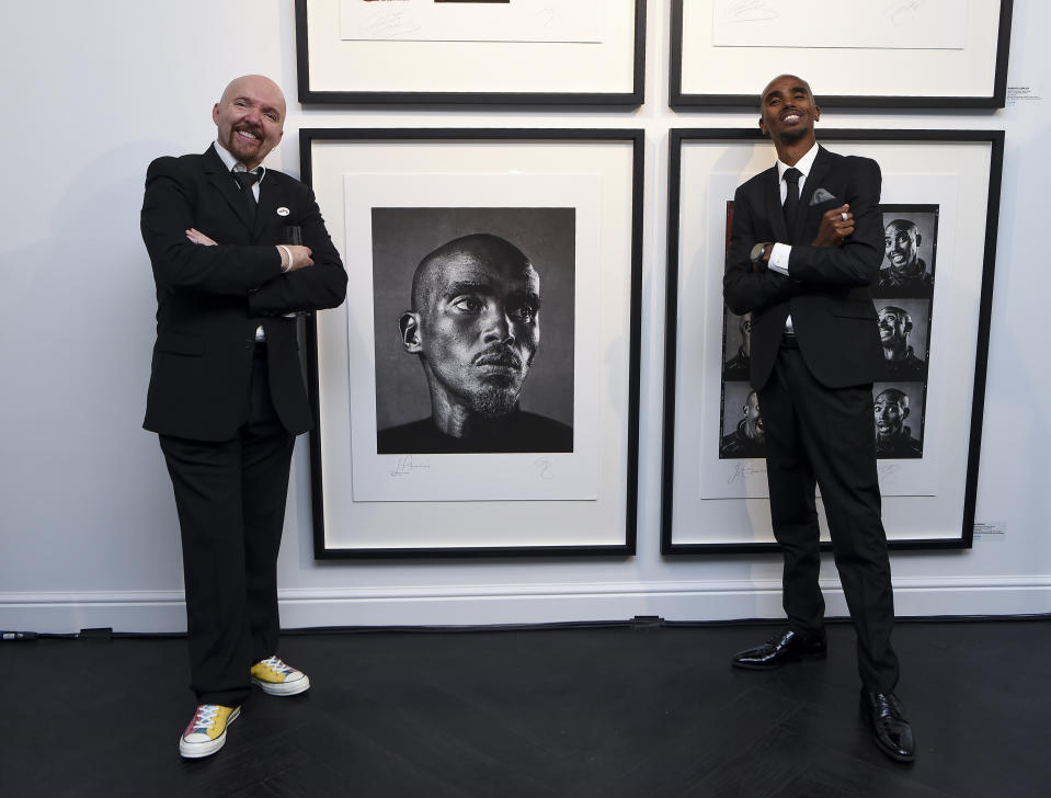 Andy Gotts with Sir Mo Farah by his portrait at the launch of Faces Of Soccer Aid’ (Daniel Hambury/Unicef/Soccer Aid Productions/Stella Pictures/PA)