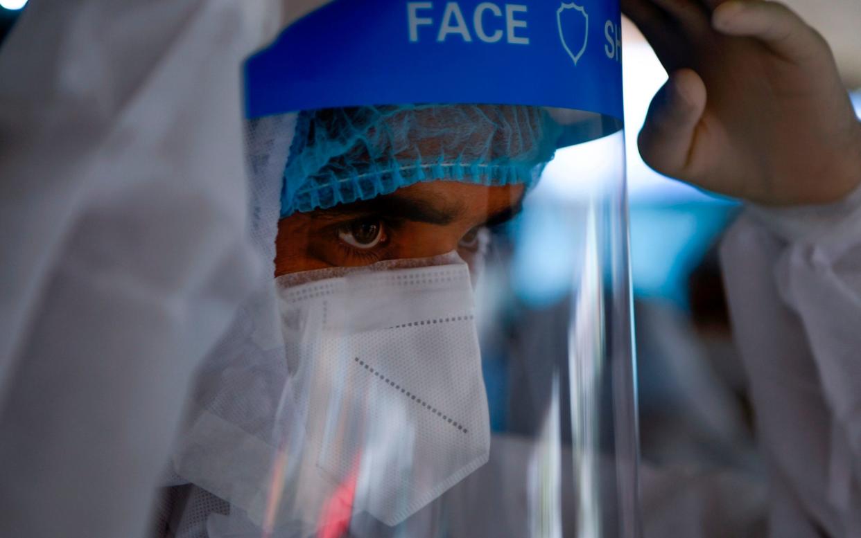 A cross-party inquiry into the handling of the coronavirus crisis heard that religious medical professionals should be provided with 'suitable alternatives' to standard PPE masks -  AFP via Getty Images