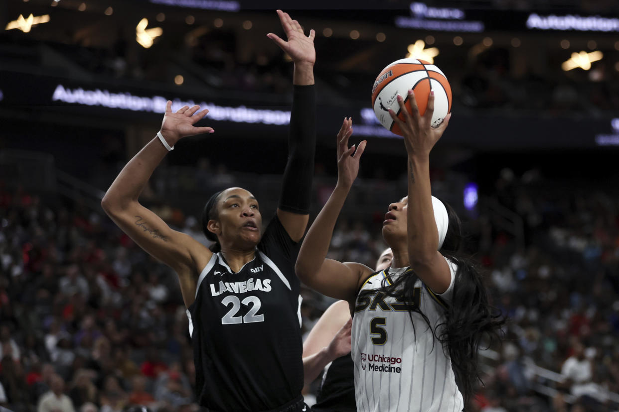 Chicago Sky forward Angel Reese (5) shoots against Las Vegas Aces center A'ja Wilson (22) during the first half of a WNBA basketball game on Tuesday, Sept. 3, 2024, in Las Vegas. (Ellen Schmidt/Las Vegas Review-Journal via AP)