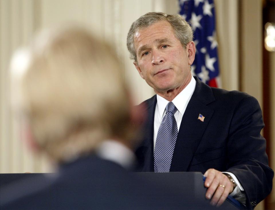 President George W. Bush listens to a reporter John Dickerson’s question during a nationally televised news conference at the White House April 13, 2004. (Photo: Larry Downing/Reuters)