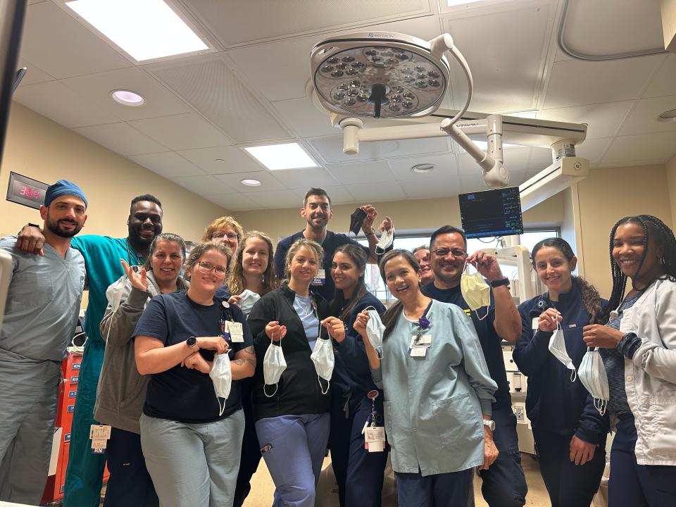 Emergency department staff at Trinity Health Livonia Hospital with their masks off after an announcement April 13, 2023, that many Michigan health care systems would be relaxing mask requirements for employees, patients and visitors more than three years after the COVID-19 pandemic began.