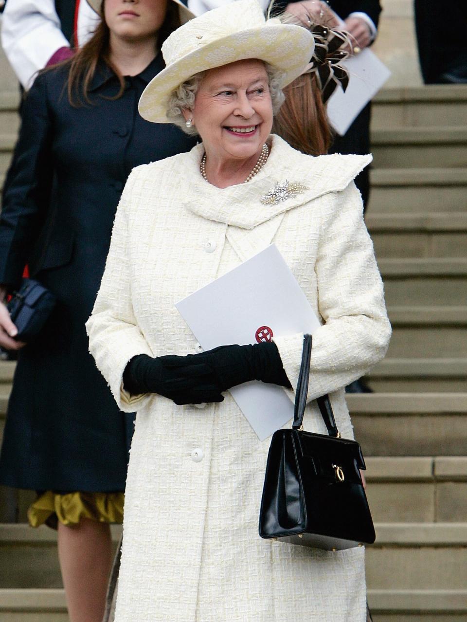 Queen Elizabeth in cream outfit leaves the Service of Prayer and Dedication blessing the marriage of the Prince of Wales, Prince Charles and the Duchess of Cornwall, Camilla Parker-Bowles at Windsor Castle