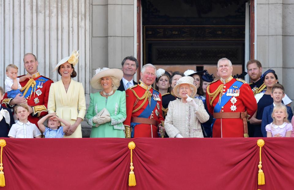 (L-R) Britain's Prince William, Duke of Cambridge holding Prince Louis, Prince George, Princess Charlotte, Britain's Catherine, Duchess of Cambridge, Britain's Camilla, Duchess of Cornwall, Vice Admiral Timothy Laurence, Britain's Prince Charles, Prince of Wales, Britain's Princess Beatrice of York, Britain's Princess Anne, Princess Royal,, Britain's Queen Elizabeth II, Britain's Princess Eugenie of York, Britain's Lady Louise Windsor, Britain's Prince Andrew, Duke of York,, Britain's Prince Harry, Duke of Sussex,, Britain's Meghan, Duchess of Sussex, James, Viscount Severn and Isla Phillips stand with other members of the Royal Family on the balcony of Buckingham Palace to watch a fly-past of aircraft by the Royal Air Force, in London on June 8, 2019. - The ceremony of Trooping the Colour is believed to have first been performed during the reign of King Charles II. Since 1748, the Trooping of the Colour has marked the official birthday of the British Sovereign. Over 1400 parading soldiers, almost 300 horses and 400 musicians take part in the event. (Photo by Daniel LEAL-OLIVAS / AFP)        (Photo credit should read DANIEL LEAL-OLIVAS/AFP/Getty Images)