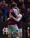 Burnley's Matej Vydra, right, celebrates scoring with teammate Wout Weghorst during the English Premier League soccer match at Turf Moor, Burnley, England, Sunday April 24, 2022. (Martin Rickett/PA via AP)