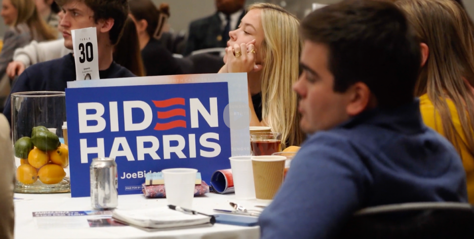 Young Democrats sit around tables and listen to speeches at the Young Democrats of North Carolina Convention (Julia Saqui)