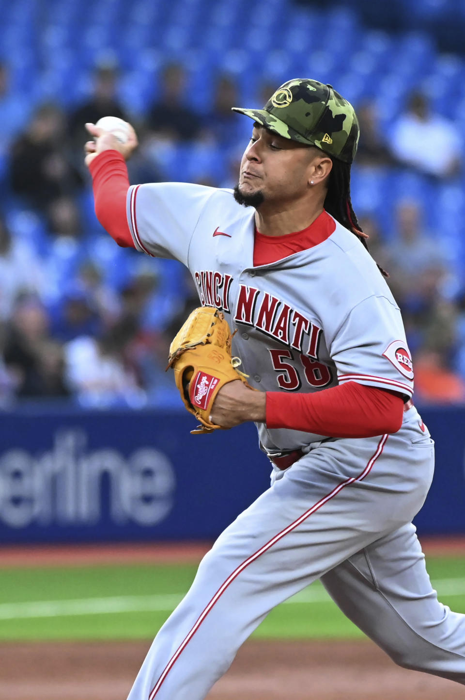 Cincinnati Reds' Luis Castillo pitches to a Toronto Blue Jays batter during the first inning of a baseball game Friday, May 20, 2022, in Toronto. (Jon Blacker/The Canadian Press via AP)