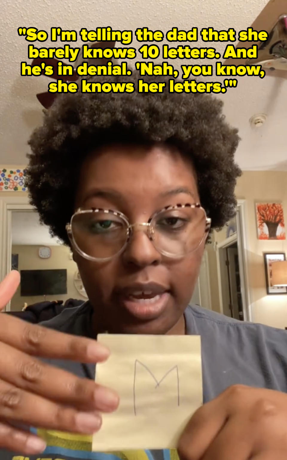 Odion talking about how a dad wouldn't understand that his child didn't know their letters, and holding up a Post-It flashcard with a letter