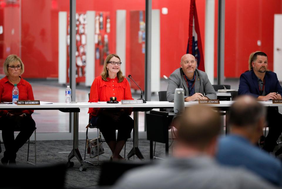 Ozark school board president Sarah Adams Orr takes a question from a parent Tuesday during a town hall meeting.