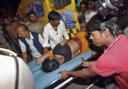 A woman who was injured in a stampede is moved to a hospital for treatment in Patna October 3, 2014. REUTERS/Stringer