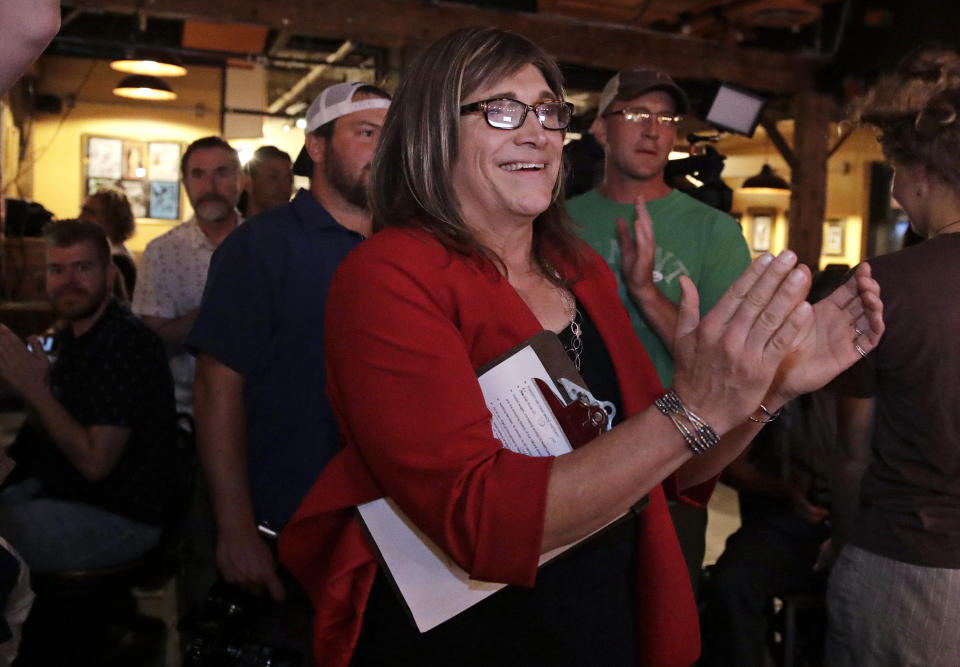 Vermont Democratic gubernatorial candidate Christine Hallquist, a transgender woman and former electric company executive, applauds with her supporters during her election night party in Burlington, Vt., Tuesday, Aug. 14, 2018. (AP Photo/Charles Krupa)